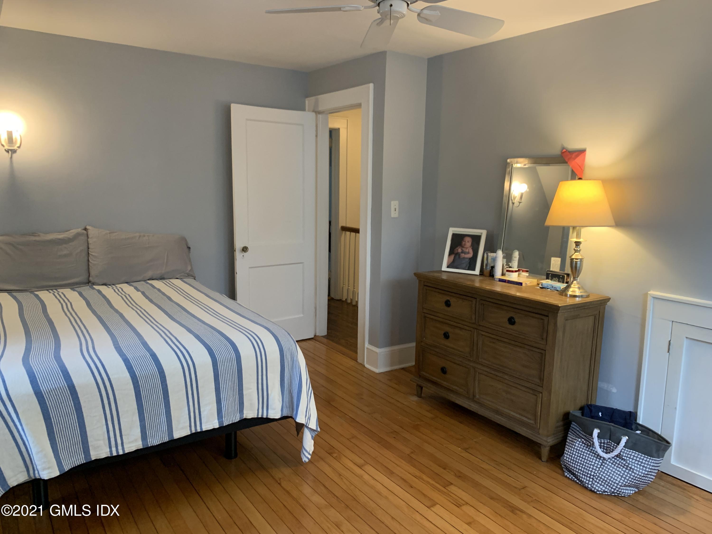 34 Sinawoy Road Cos Cob, CT 06807 - Photo 12 of 16 a bedroom with a bed and a dresser