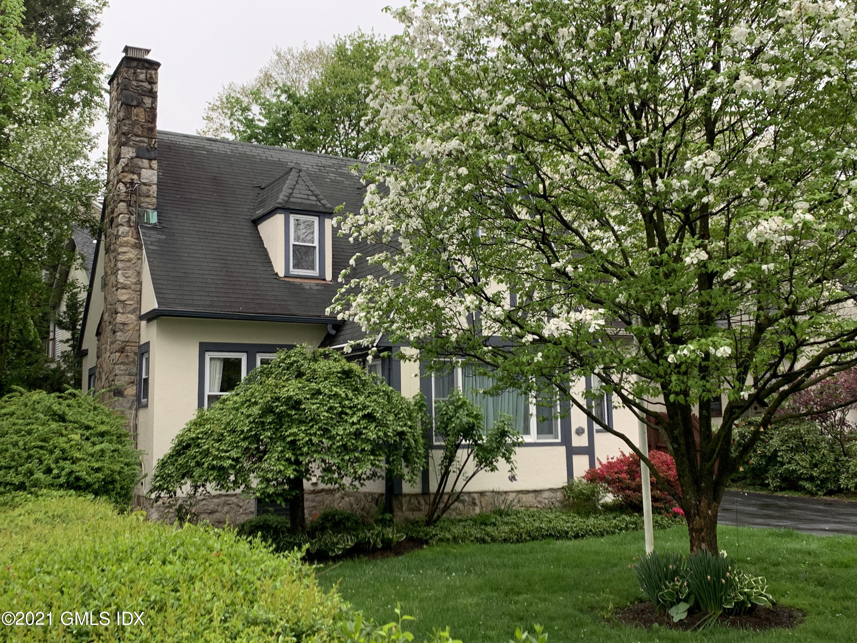 34 Sinawoy Road Cos Cob, CT 06807 - Photo 2 of 16 front view of a house with a yard