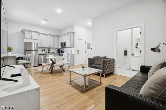 a living room with furniture and a table