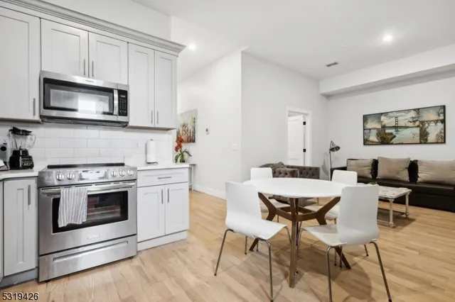 a kitchen with a stove top oven and sink