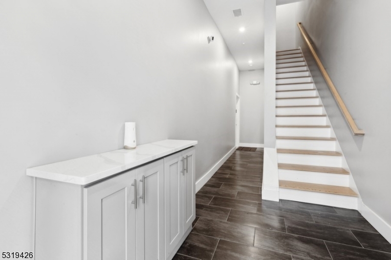 104 Fleming Avenue, Unit 201 Newark, NJ 07105 - Photo 28 of 33 a hallway with stairs