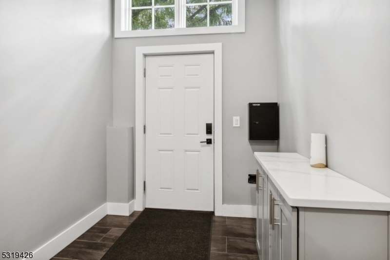 104 Fleming Avenue, Unit 201 Newark, NJ 07105 - Photo 30 of 33 a bathroom with a sink and a mirror