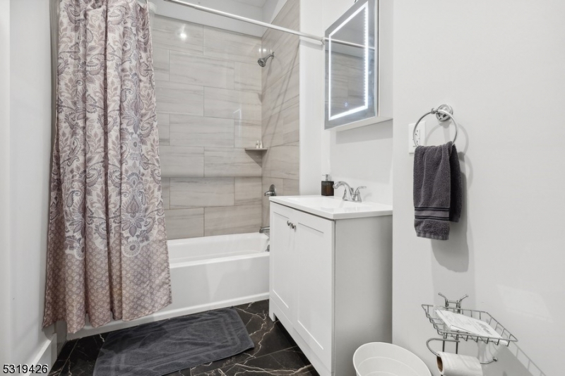 104 Fleming Avenue, Unit 201 Newark, NJ 07105 - Photo 5 of 33 a bathroom with a sink toilet and shower