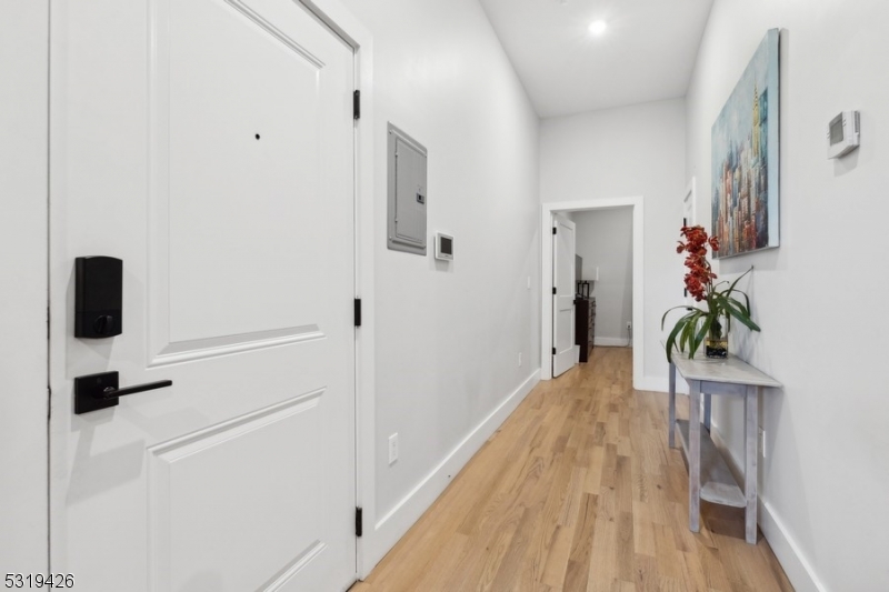 104 Fleming Avenue, Unit 201 Newark, NJ 07105 - Photo 8 of 33 a hallway with wooden floor