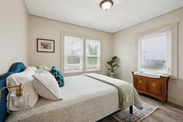 a bedroom with a bed and window