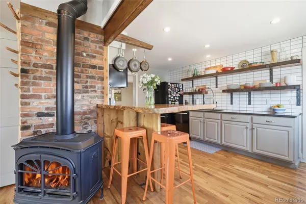 a kitchen with stainless steel appliances granite countertop a stove and cabinets