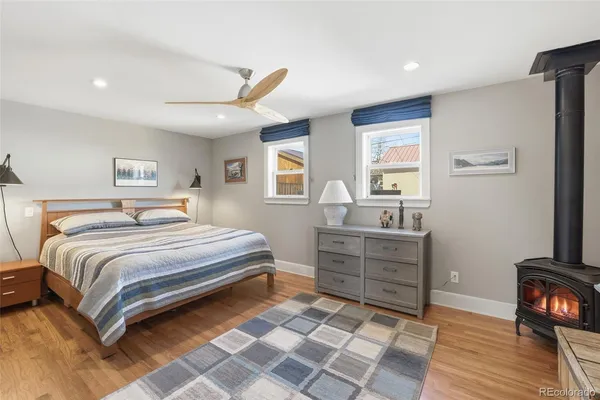 a bedroom with a bed and a television