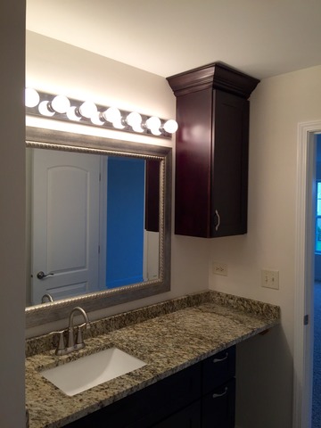 326 Prairie Ridge Drive Minooka, IL 60447 - Photo 13 of 16 a bathroom with a granite countertop sink and a mirror