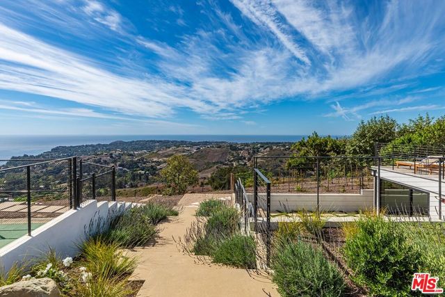 a white bath tub sitting in a bathroom