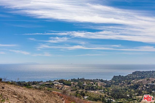 a bathroom with a tub and a shower