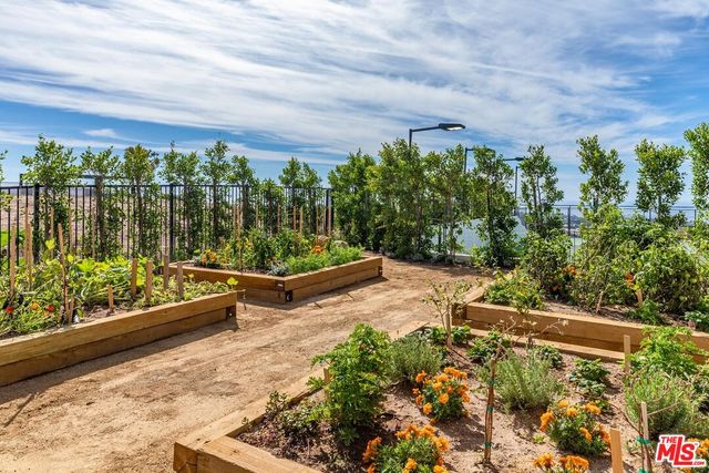 a view of a livingroom with furniture window and wooden floor