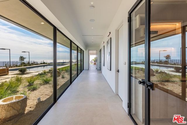 a bathroom with a granite countertop sink a toilet a mirror and shower