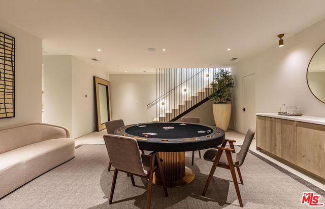 a spacious bedroom with a large bed and a fireplace