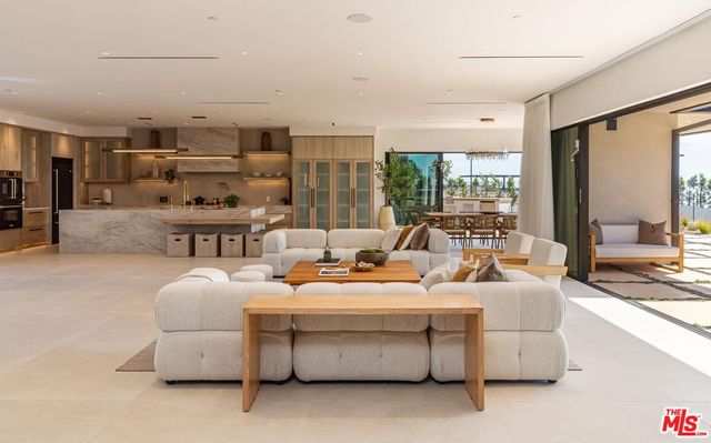 a living room with furniture or outdoor view and kitchen view