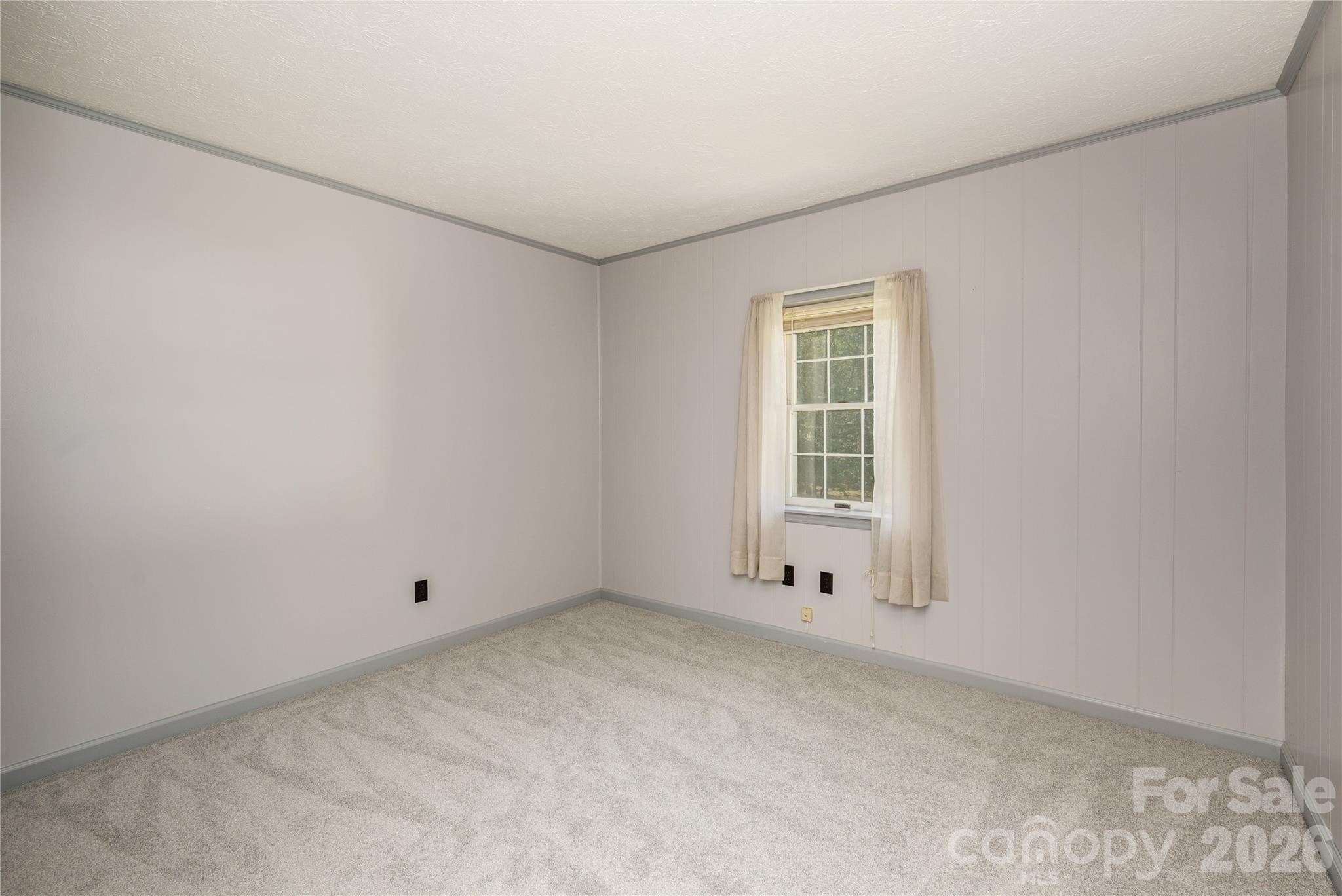 231 Allen Road East Flat Rock, NC 28726 - Photo 26 of 42 a view of an empty room with a window