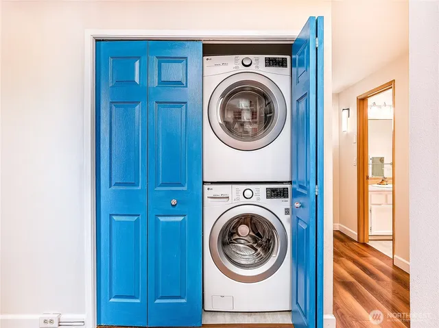 a view of a hallway with washer and dryer