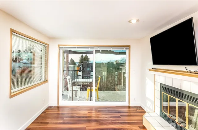 a living room with fireplace furniture and a flat screen tv