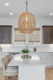 a kitchen with a sink and a window