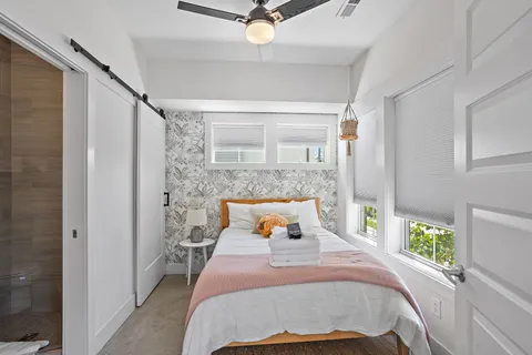 a bedroom with a bed and window