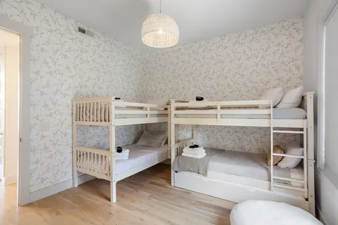 a bedroom with a bed and a chair