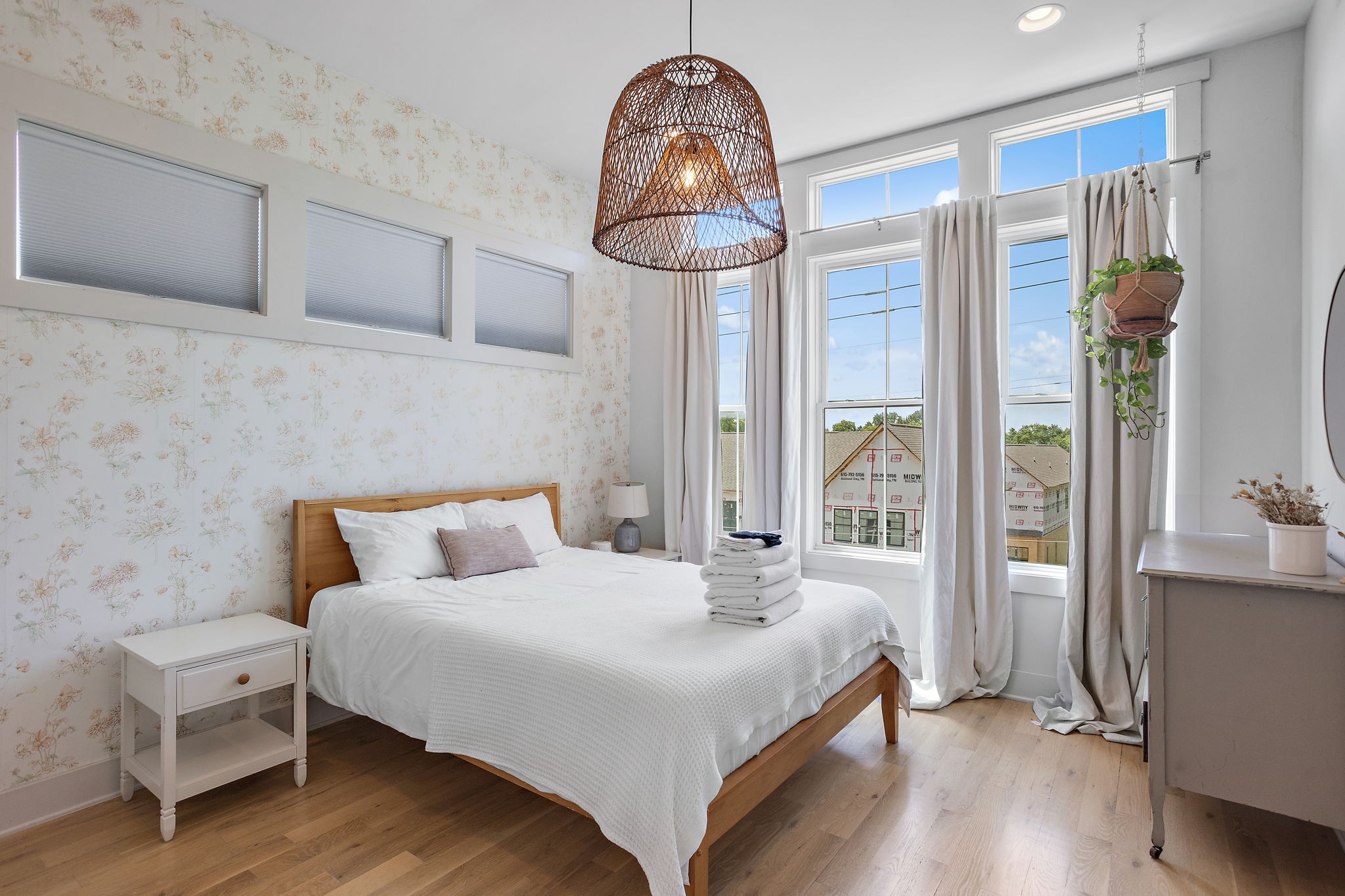 1027 East Trinity Lane, Unit 5 Nashville, TN 37216 - Photo 24 of 34 a bedroom with a bed and a chandelier