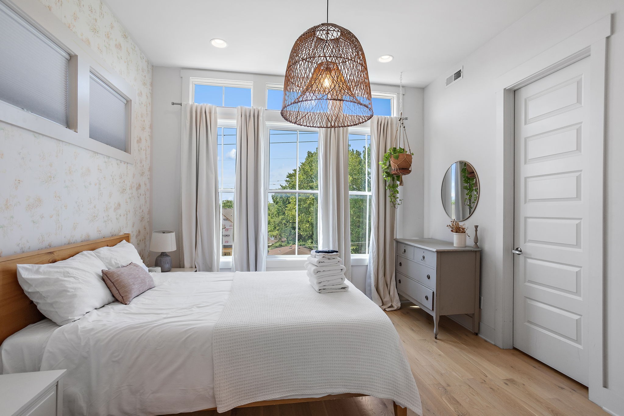 1027 East Trinity Lane, Unit 5 Nashville, TN 37216 - Photo 25 of 34 a bedroom with a bed and a chandelier