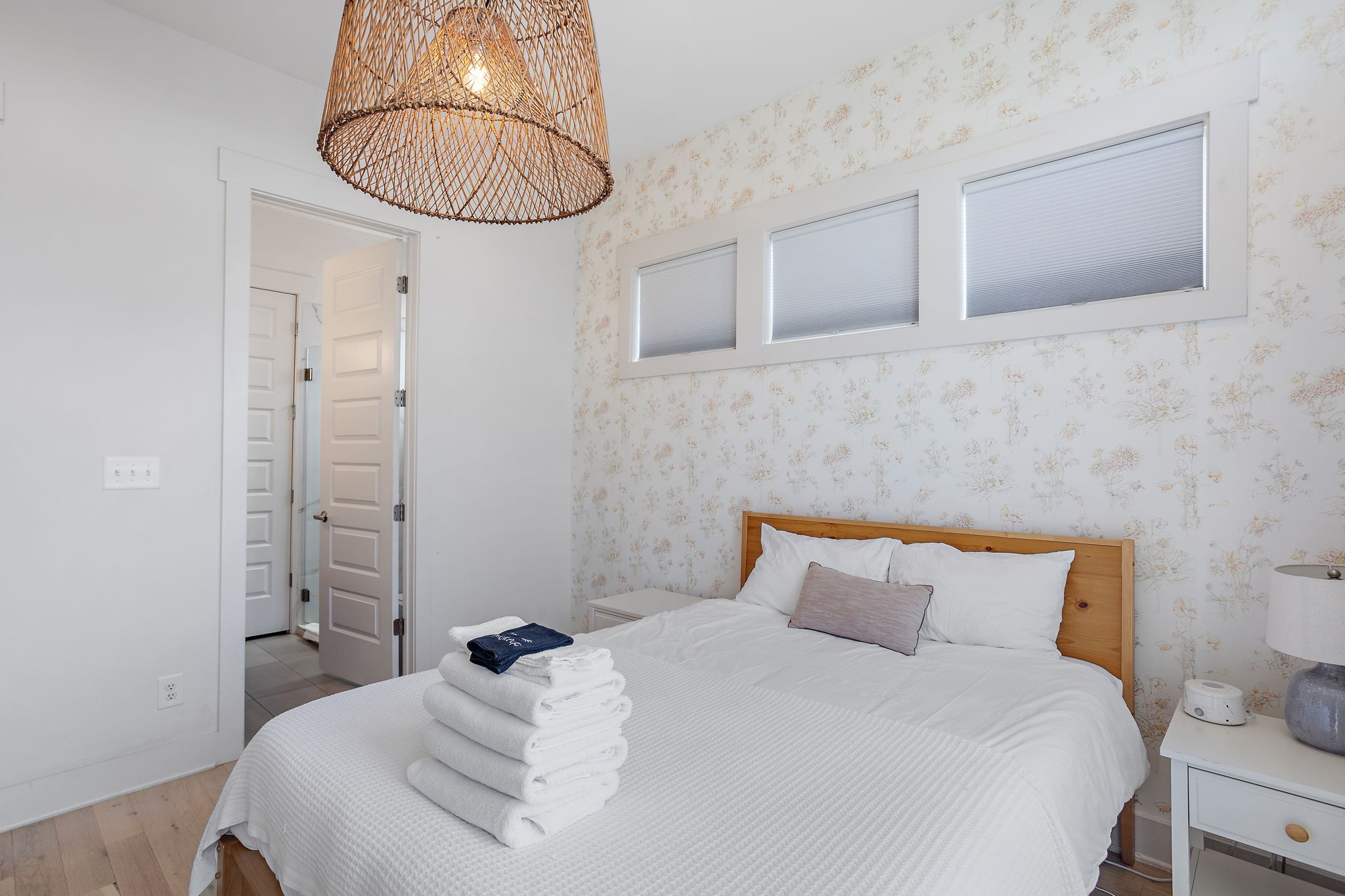 1027 East Trinity Lane, Unit 5 Nashville, TN 37216 - Photo 29 of 34 a bedroom with a bed and a chandelier