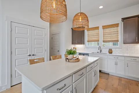 a kitchen with a sink cabinets and window