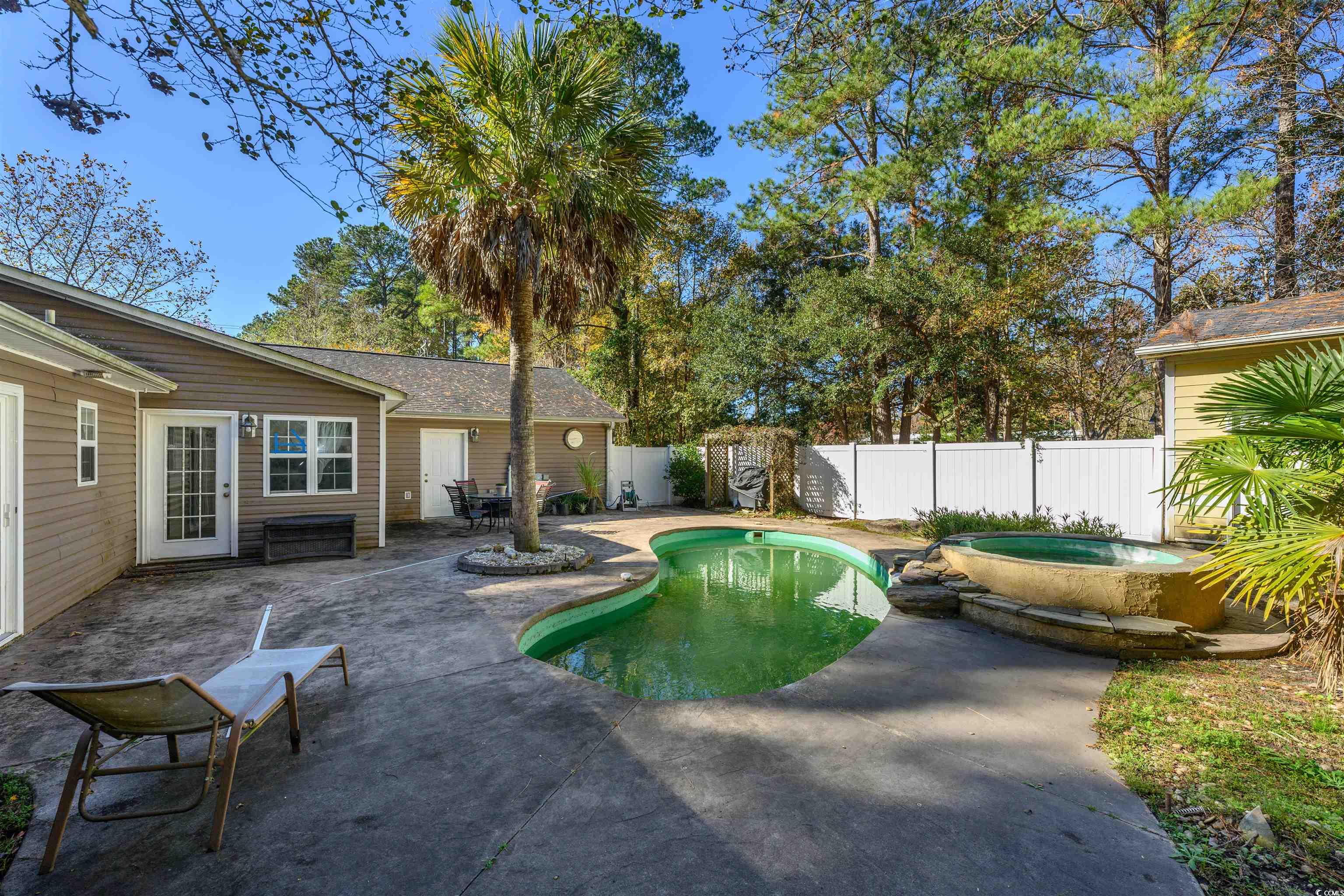 6252 Salem Road Myrtle Beach, SC 29588 - Photo 17 of 39 View of swimming pool featuring an in ground hot tub and a patio