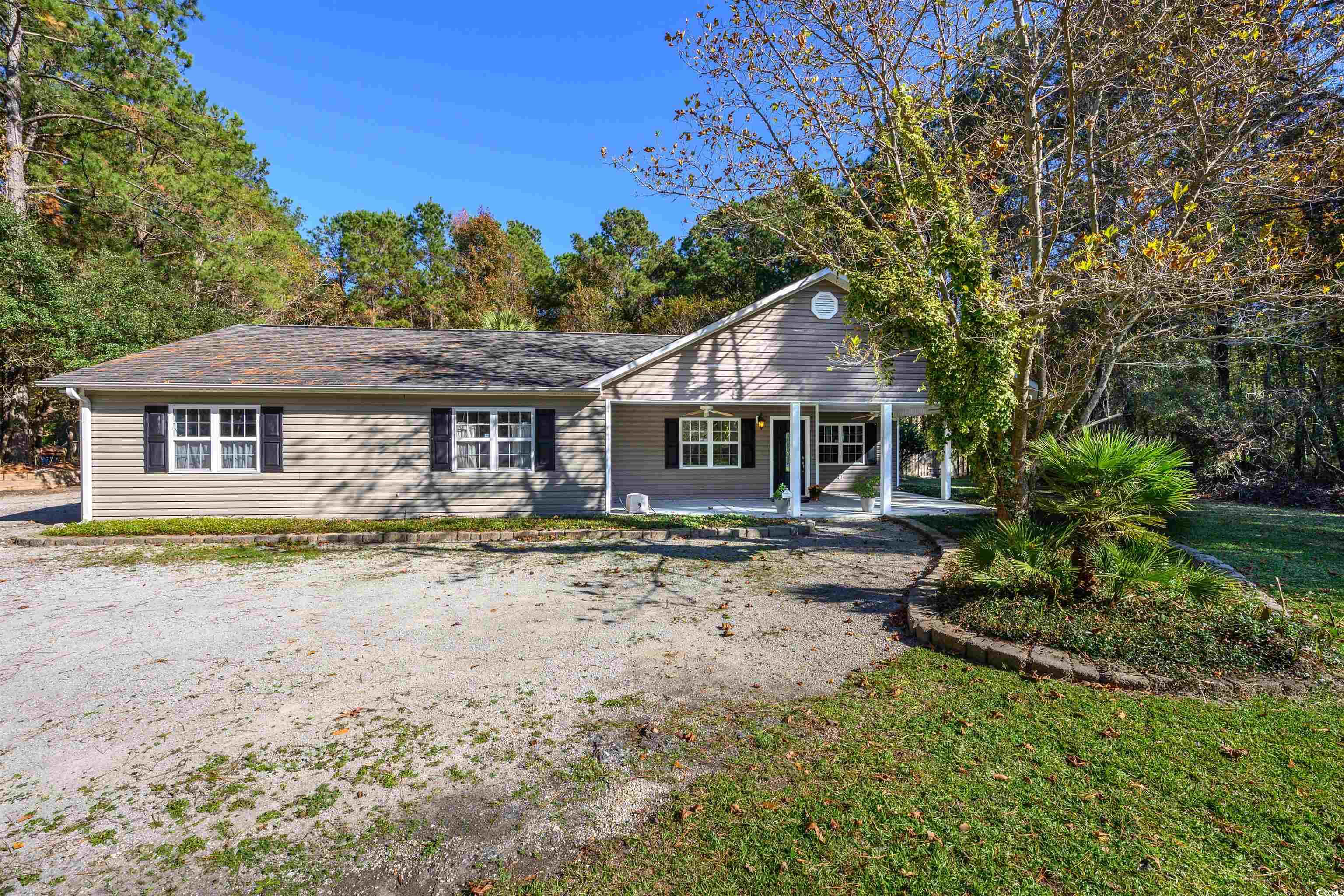 6252 Salem Road Myrtle Beach, SC 29588 - Photo 3 of 39 Ranch-style home with covered porch and a front yard