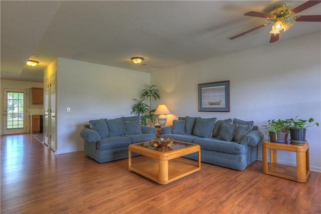 2148 Spring Hill Circle Spring Hill, TN 37174 - Photo 3 of 18 Large living room with new laminate wood flooring.