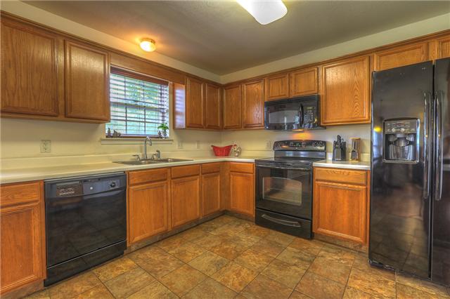 2148 Spring Hill Circle Spring Hill, TN 37174 - Photo 5 of 18 Kitchen features include NEW tile floor & NEW GE appliances.