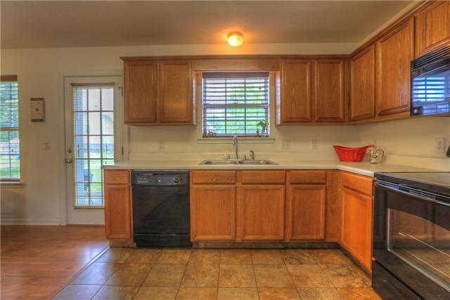 2148 Spring Hill Circle Spring Hill, TN 37174 - Photo 6 of 18 Another view of the kitchen with access door to the patio.