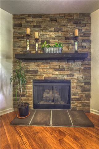 2148 Spring Hill Circle Spring Hill, TN 37174 - Photo 9 of 18 NEW Centurion stone fireplace with gas log insert and custom wood mantle.