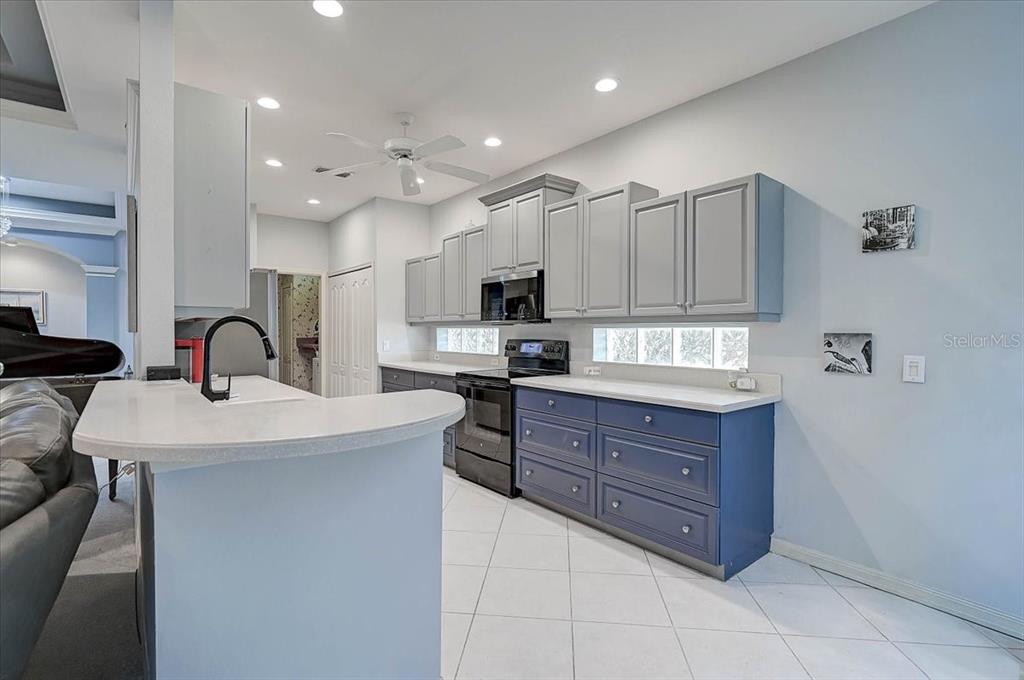103 Bishopscourt Road Osprey, FL 34229 - Photo 10 of 55 a kitchen with granite countertop a stove and a sink