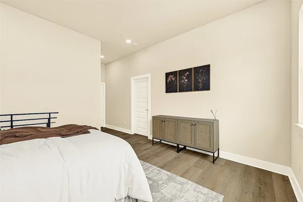 a bedroom with a bed and a television