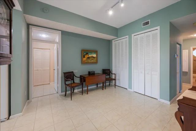 a view of a livingroom with furniture and a window
