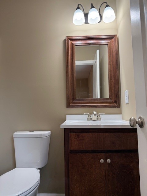 206 Hotel Street Decherd, TN 37324 - Photo 17 of 28 a bathroom with a toilet sink and mirror