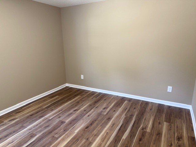 206 Hotel Street Decherd, TN 37324 - Photo 22 of 28 a view of room with wooden floor