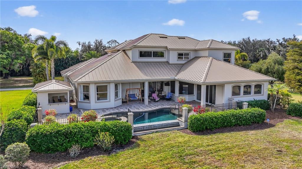 1964 Rialto Way Alva, FL 33920 - Photo 2 of 50 an aerial view of a house with swimming pool and patio