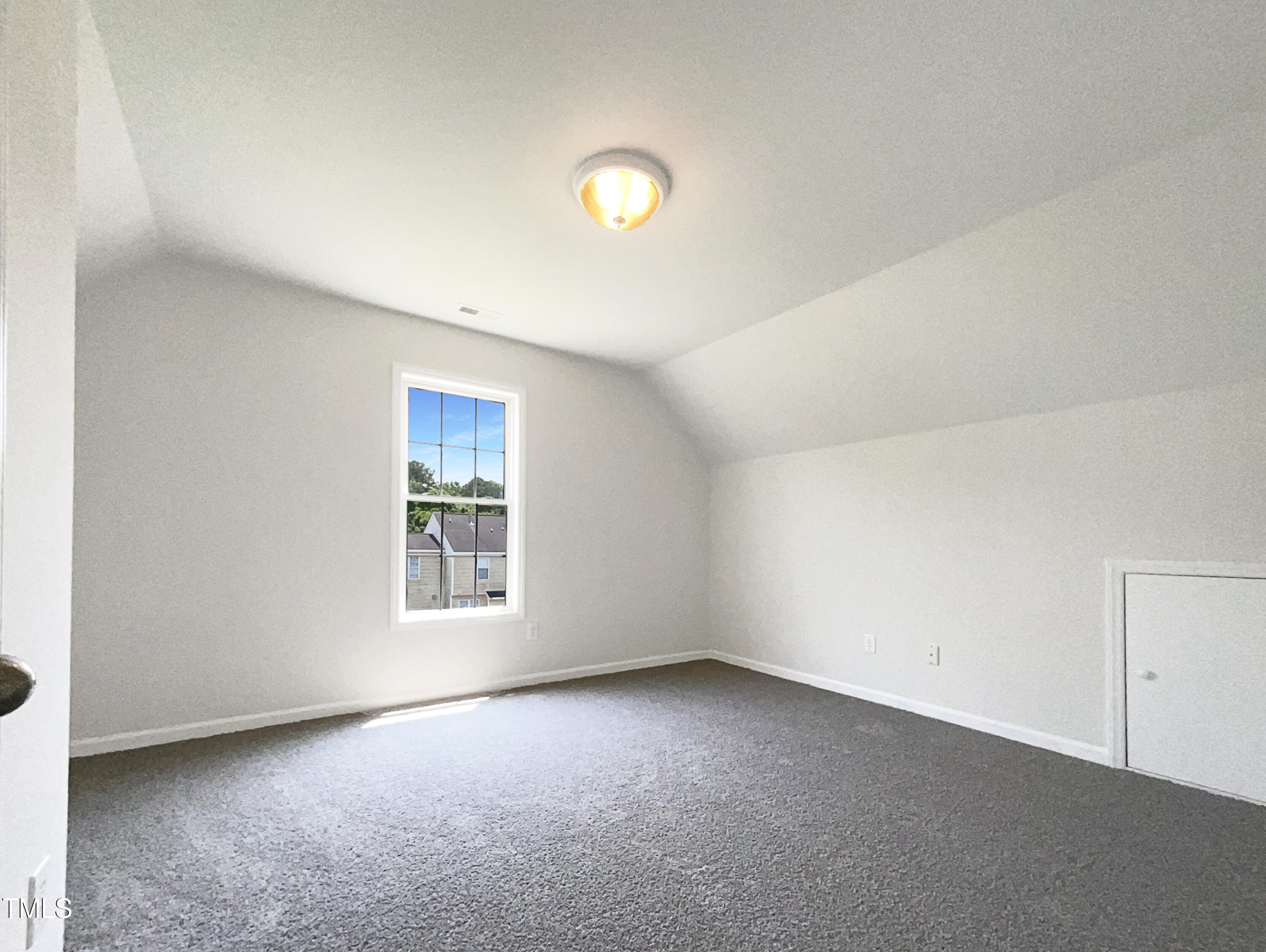 4025 Scofield Drive Raleigh, NC 27610 - Photo 16 of 18 a view of an empty room with a window