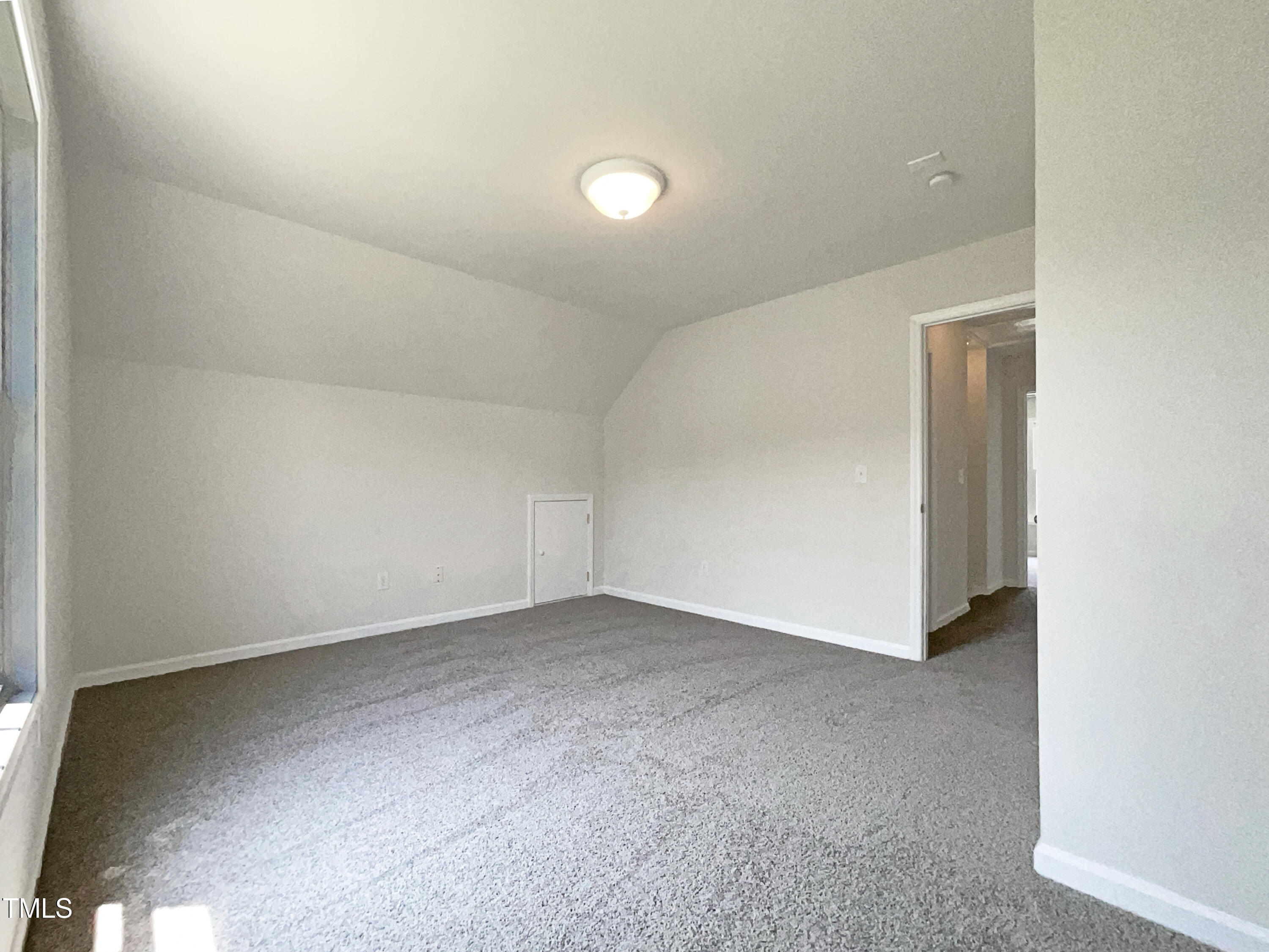 4025 Scofield Drive Raleigh, NC 27610 - Photo 17 of 18 an empty room with a natural light