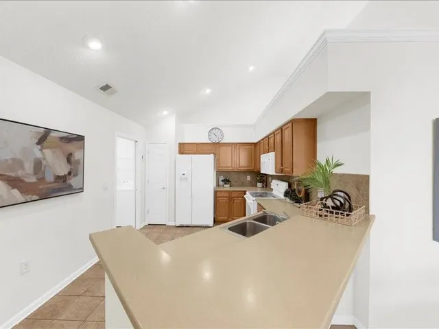 a view of a living room with furniture and a window