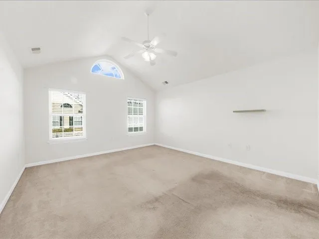 a bathroom with a sink double vanity granite and a mirror