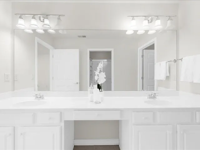 a white toilet sitting next to a shower