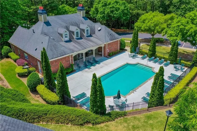 an aerial view of a house with a garden