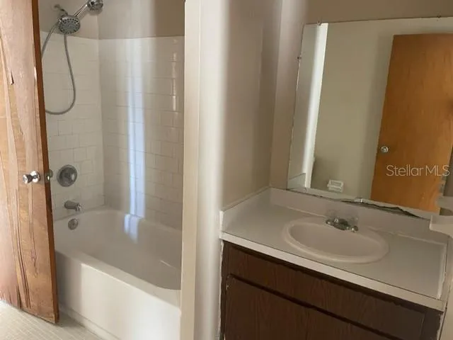 a bathroom with a sink and a shower
