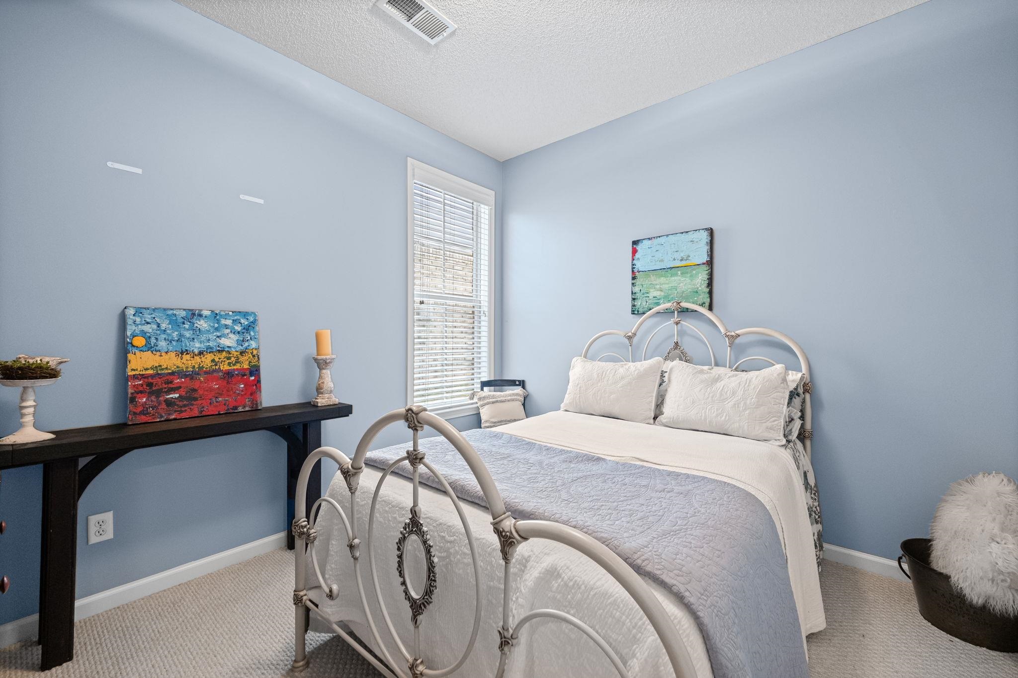 4950 Shaws Ridge Trail Arlington, TN 38002 - Photo 12 of 27 a bedroom with a bed and a flat screen tv