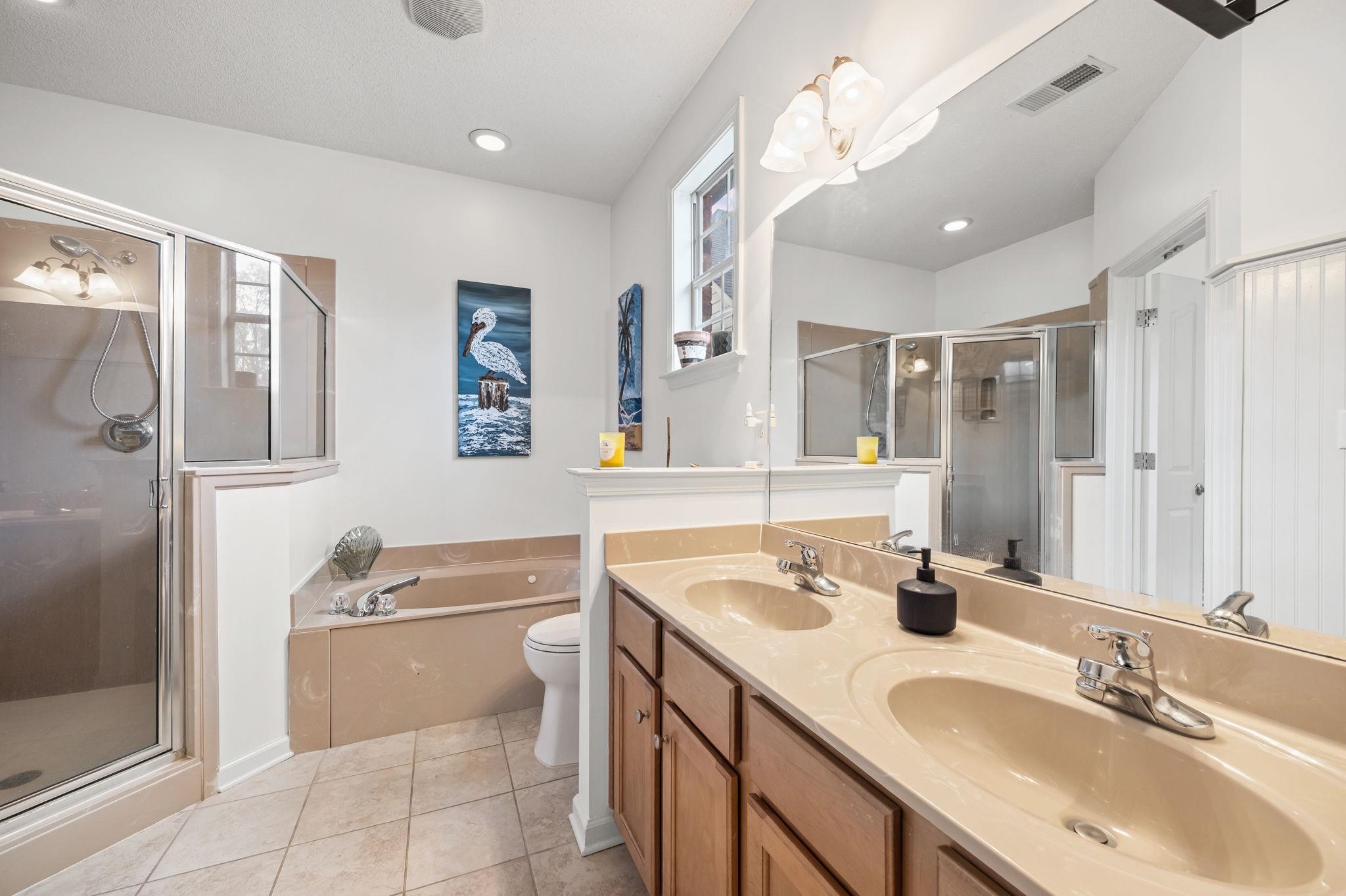 4950 Shaws Ridge Trail Arlington, TN 38002 - Photo 19 of 27 a bathroom with a granite countertop sink a mirror a vanity and shower