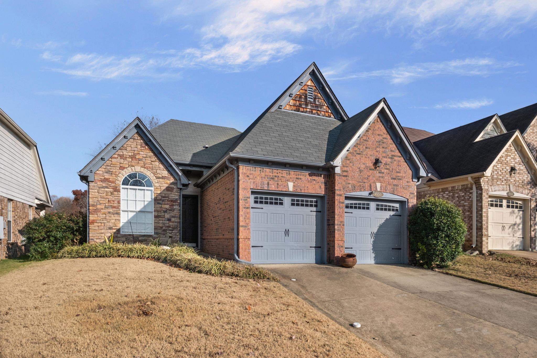 4950 Shaws Ridge Trail Arlington, TN 38002 - Photo 27 of 27 a front view of a house with a yard and garage